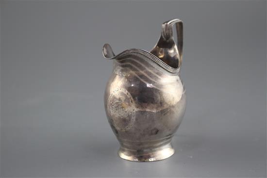 A George III engraved silver helmet shaped cream jug by George Burrows, London, 1799, height 11cm, 3.5oz.